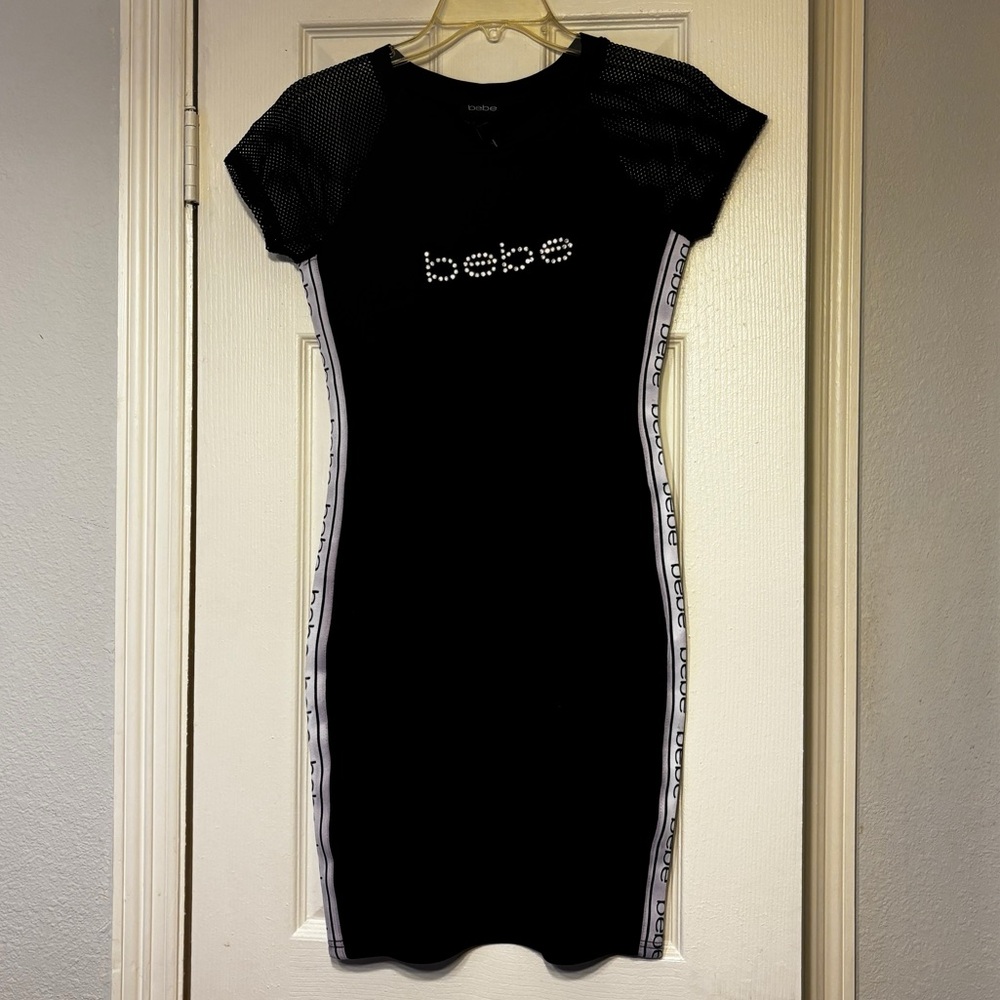 Bebe Bodycon dress. It’s size S and new with tags